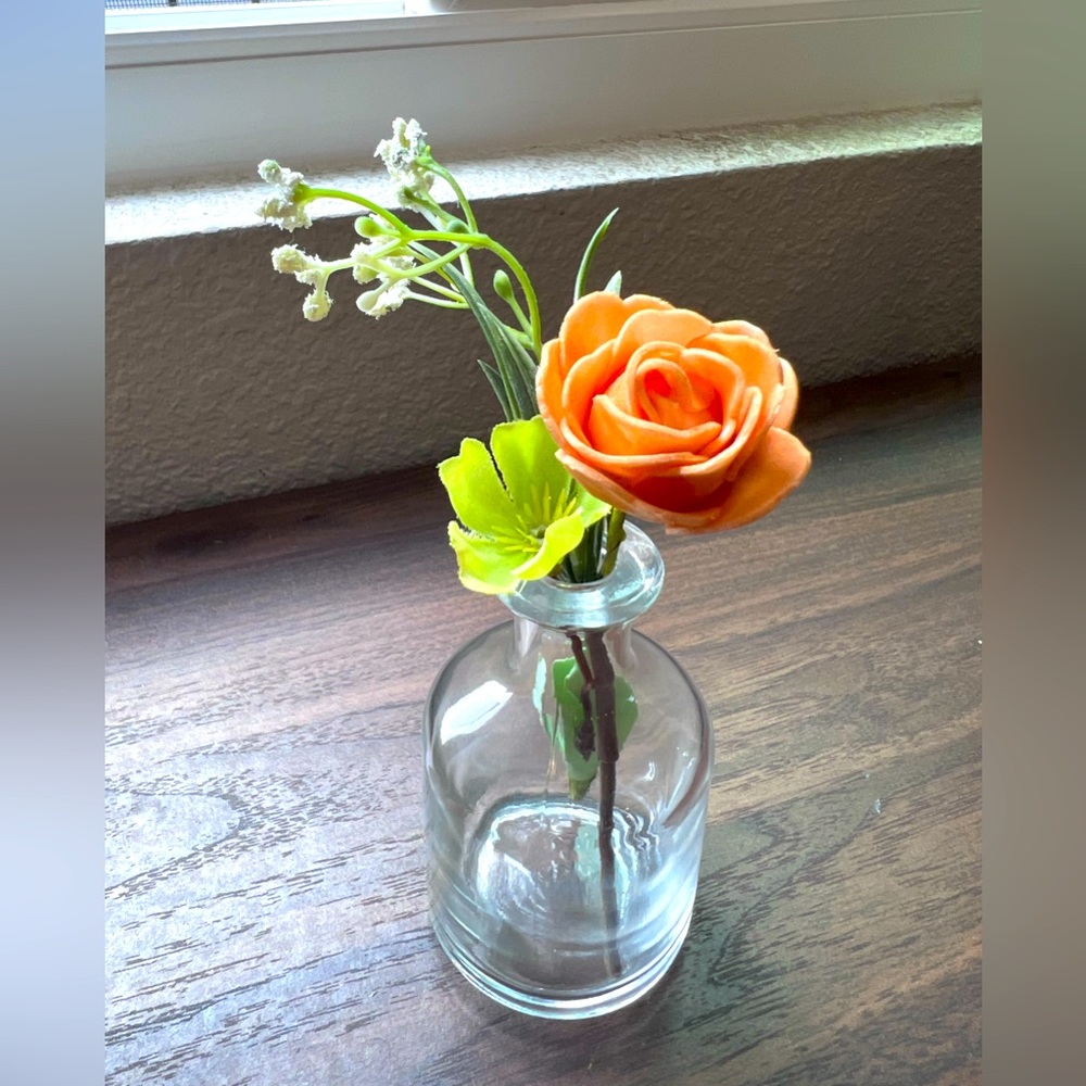 Faux flowers minimalist arrangement in vase